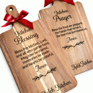 Wooden Bless This Kitchen cutting board with red ribbon and gift tag