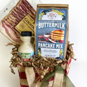 Christmas Morning Breakfast Basket with buttermilk pancake mix, maple syrup, and country bacon