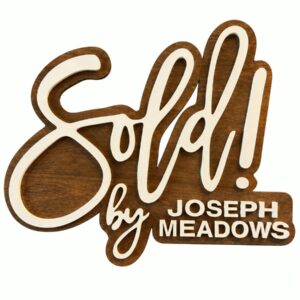 Custom wooden Sold sign personalized with an agent name