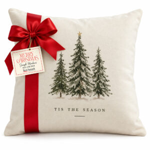 Cream pillow with three evergreen trees and Tis the Season lettering